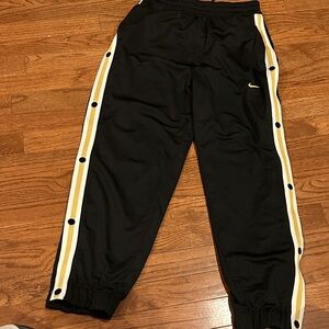 Nike Kids Black Tear Away Pants with Gold Stripes